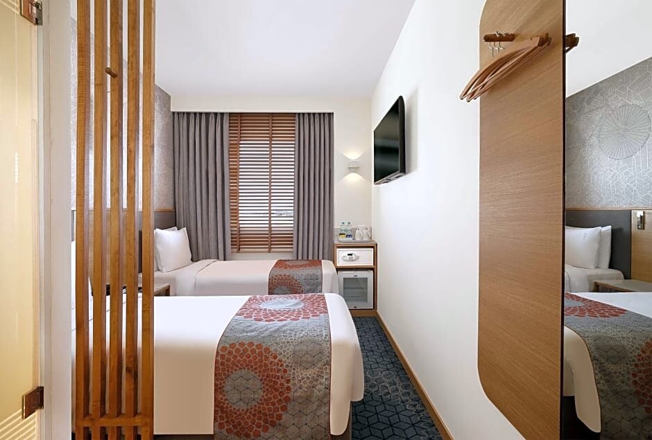 Кровать в общем номере Holiday Inn Express Pune Hinjewadi, an IHG Hotel