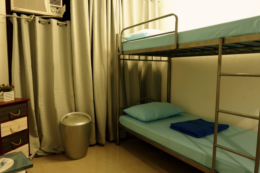 Кровать в общем номере Mactan District Budgetel - Lapu Lapu Cebu