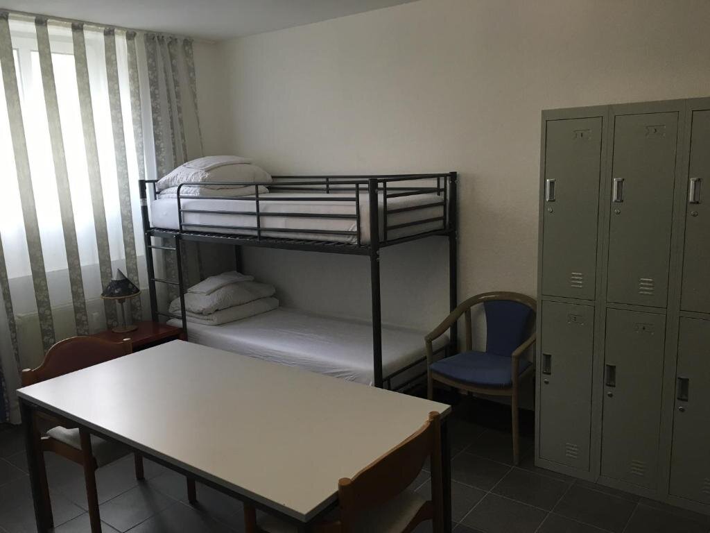Кровать в общем номере Hotel-Pension Adamshof