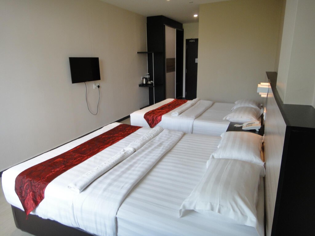 Standard quadruple chambre Galaxy Hotel