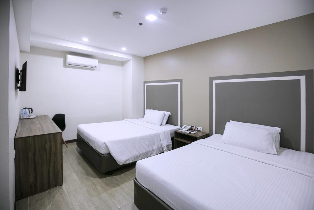 Standard Quadruple room S Hotel & Residences