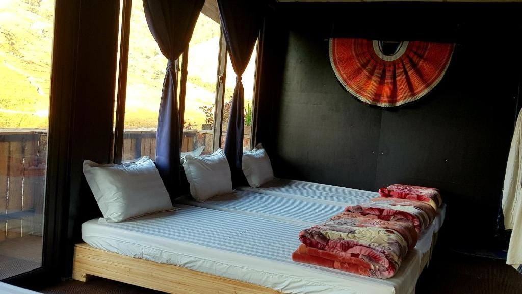 Кровать в общем номере Tavan View Homestay