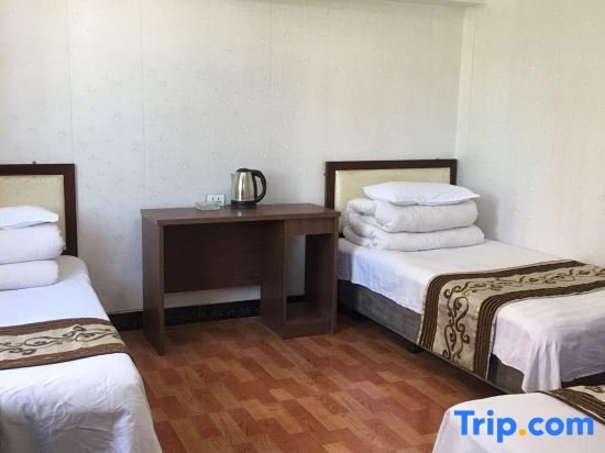 Standard triple chambre Huayang Guesthouse