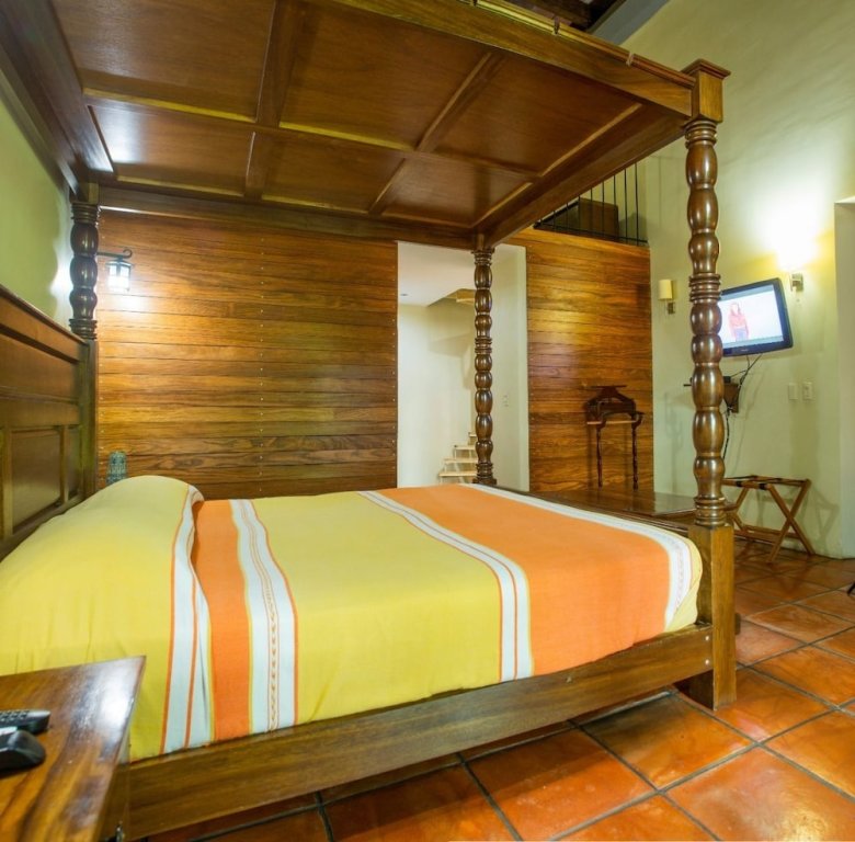 Кровать в общем номере Hotel Boutique Hacienda del Gobernador