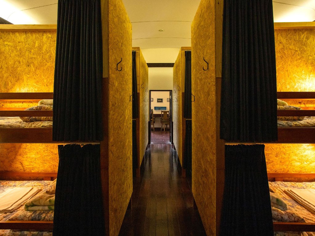 Cama en dormitorio compartido Guesthouse LAMP Bungoohno