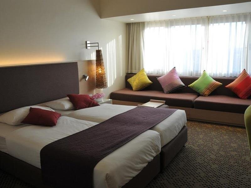 Кровать в общем номере Ramat Rachel Resort
