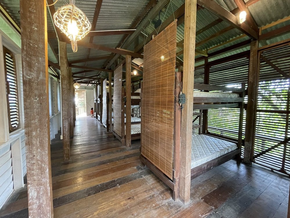 Кровать в общем номере Paganakan Dii Tropical Retreat