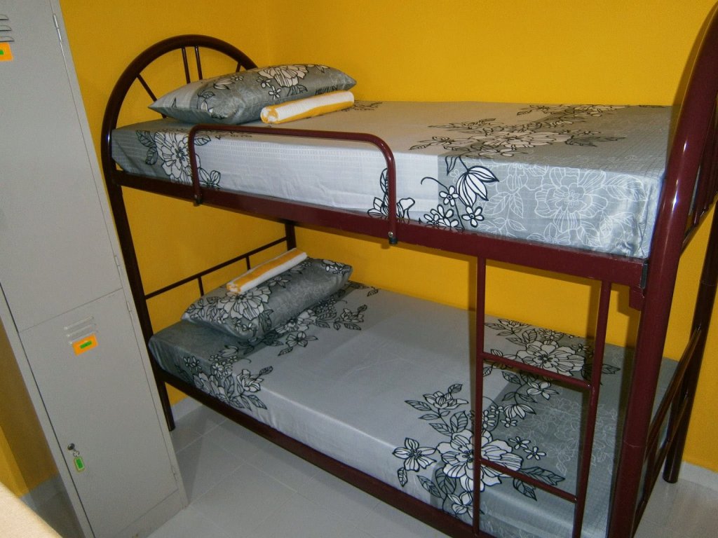 Кровать в общем номере THE COTTAGE LANGKAWI