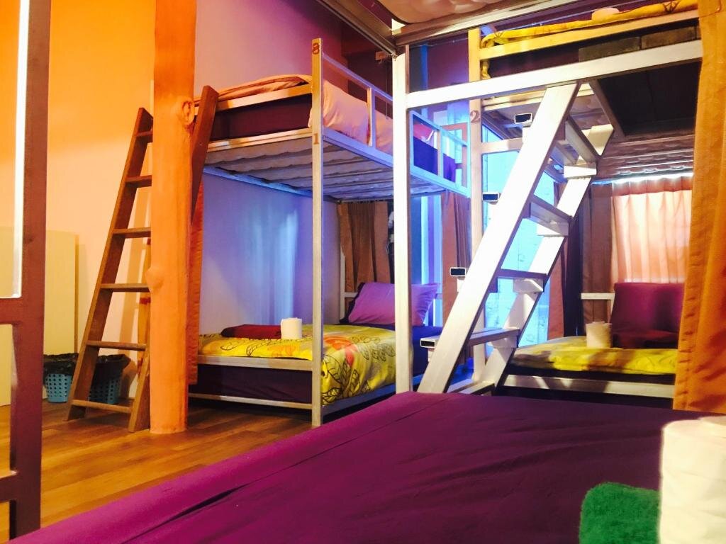 Кровать в общем номере Petit Suncliff Resort