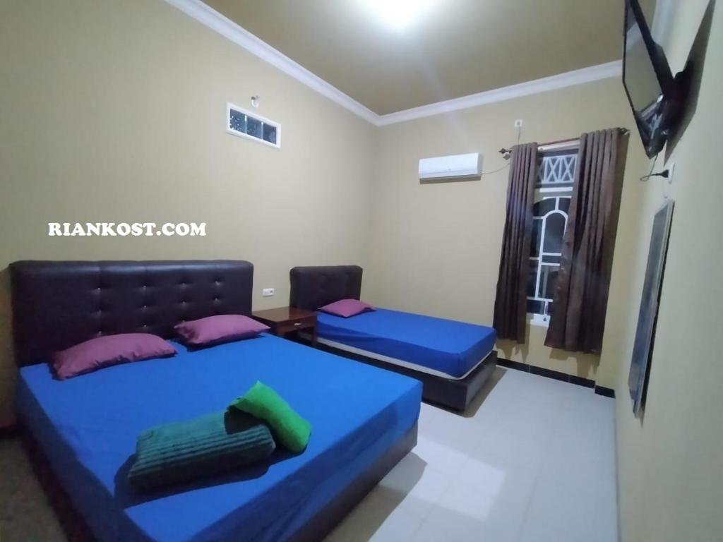 Habitación familiar Estándar Rian Kost - Hotel Penginapan Murah Pusat Kota Palembang
