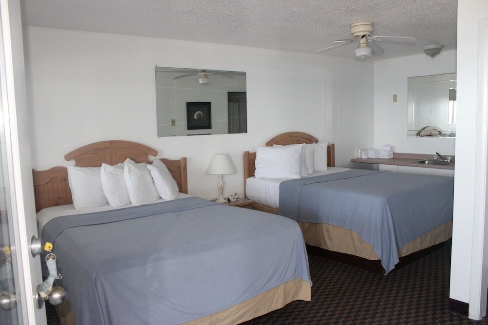 Standard Quadruple room with partial ocean view Sandcastle Beachfront Inn