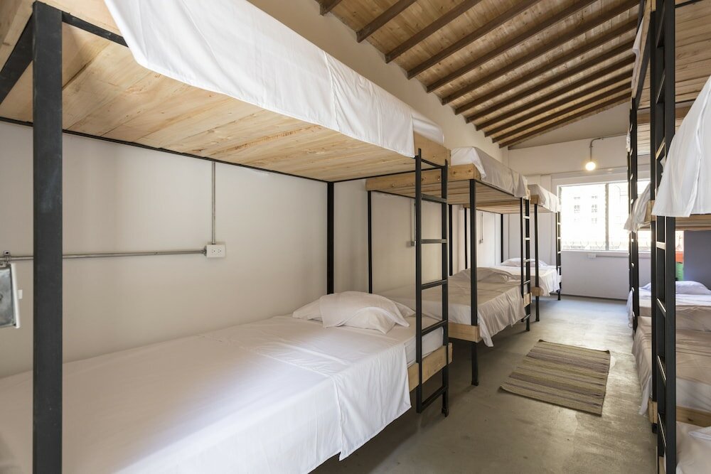 Кровать в общем номере Gastón Coliving