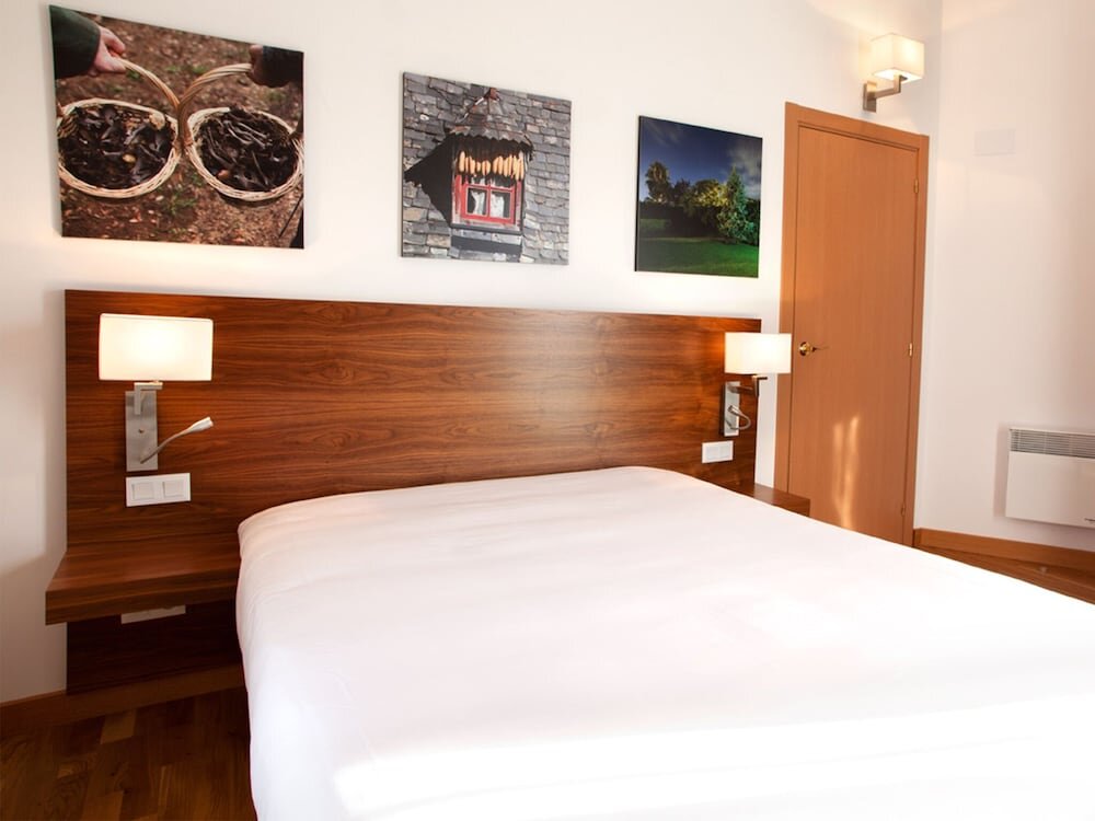 Cama en dormitorio compartido Apparthôtel et SPA Cerdanya