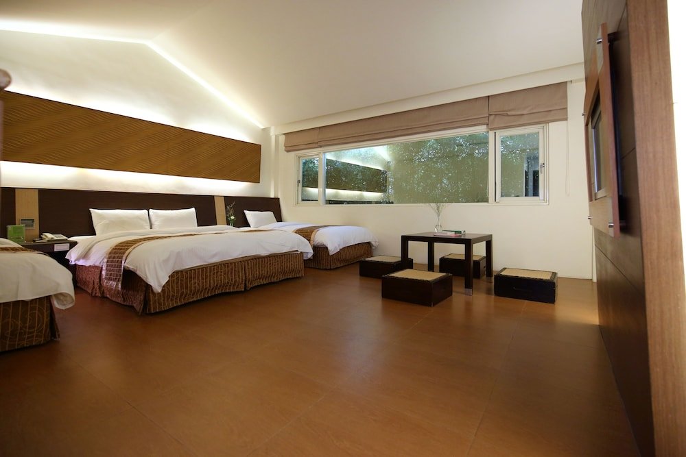 Standard Quadruple room with garden view Yi Yuan Resort