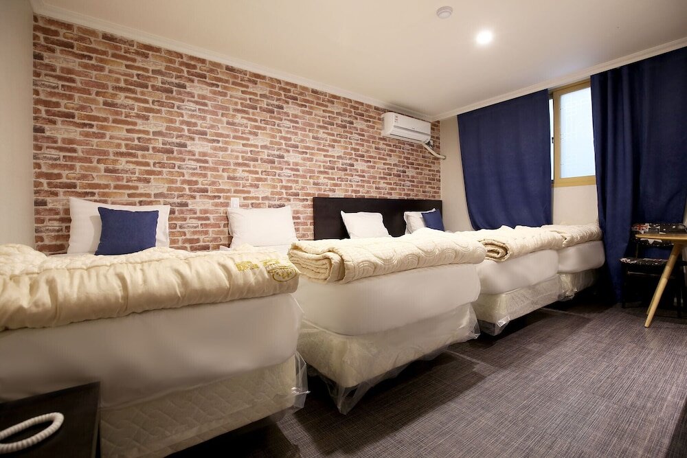 Кровать в общем номере Daejeon Dunsan Four Seasons