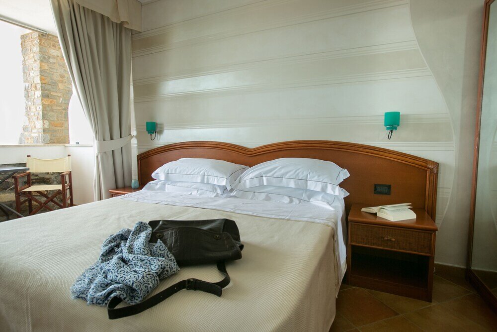 Standard Quadruple room with balcony Hotel Arc En Ciel