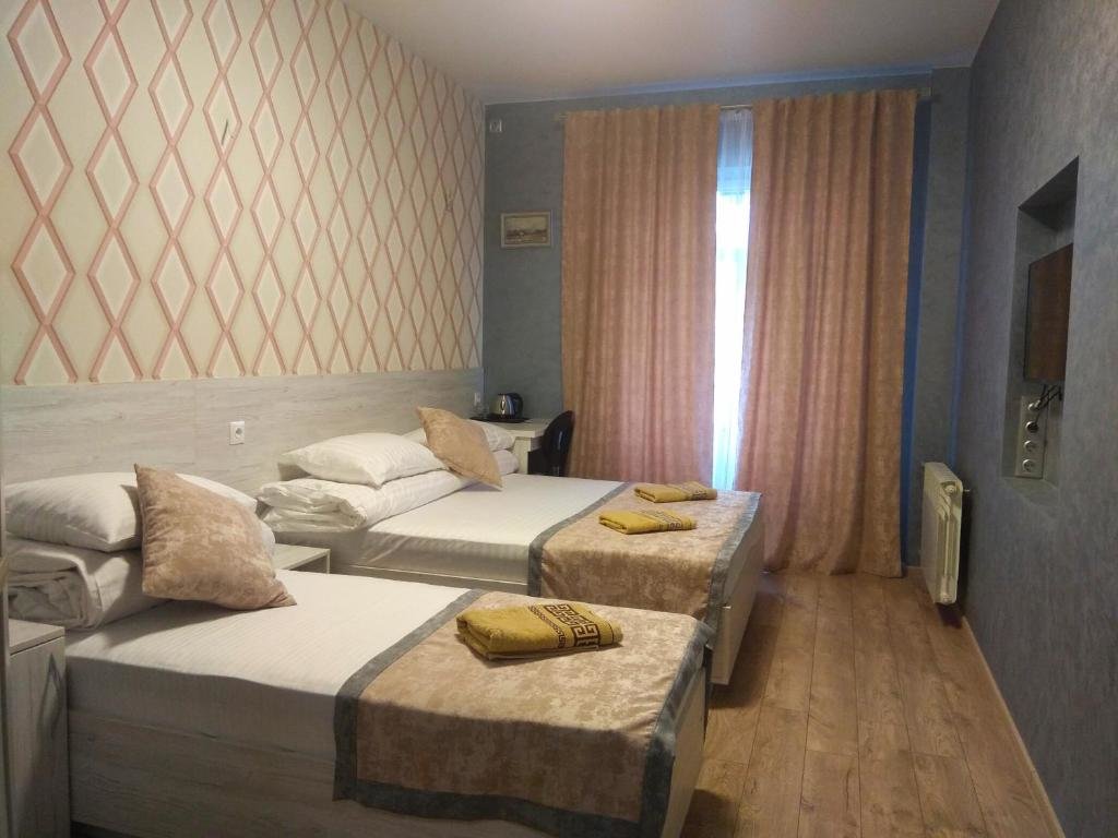 Standard triple chambre avec balcon Rivne Hostel