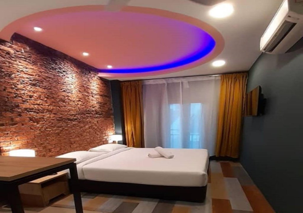 Кровать в общем номере Smile Hotel Wangsa Maju
