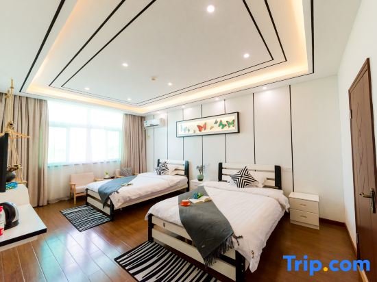 Cama en dormitorio compartido Jiuqi Wuzhen Linshe Art Hotel