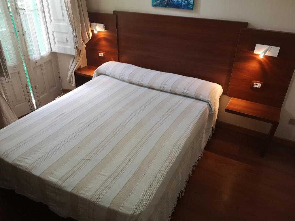 Кровать в общем номере B&B Casa Laganà