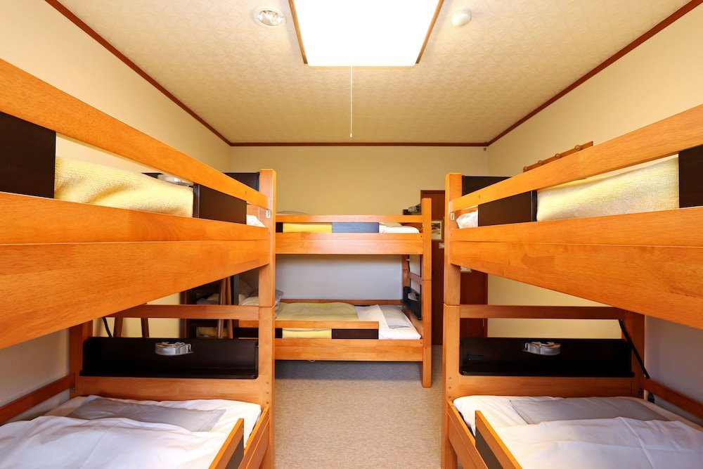 Кровать в общем номере Guesthouse Kinzaza