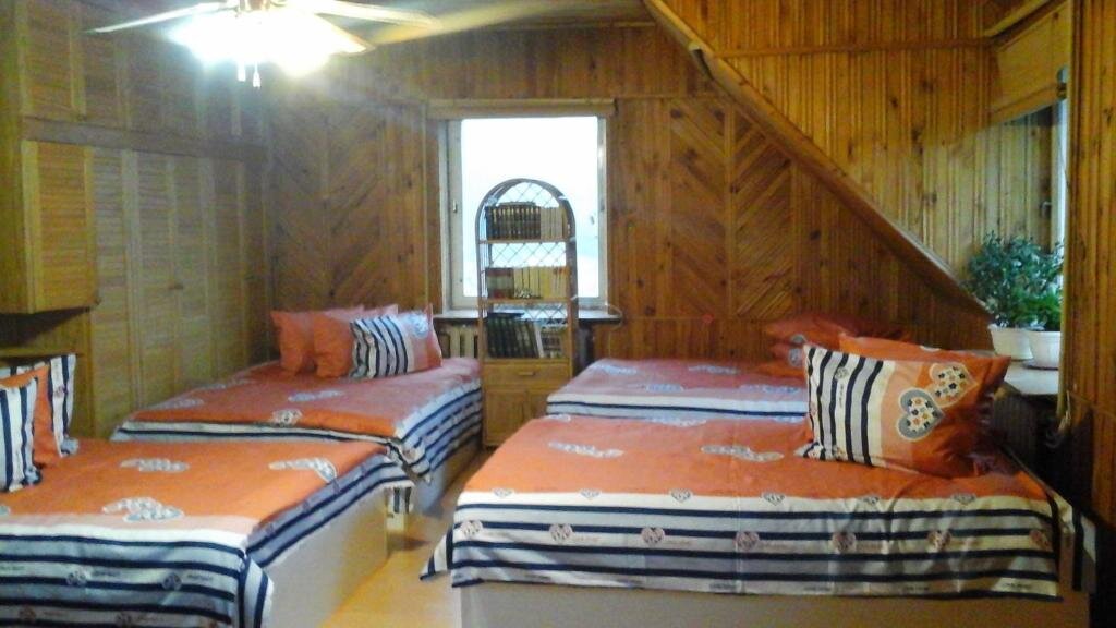 Кровать в общем номере Kryzbarkas