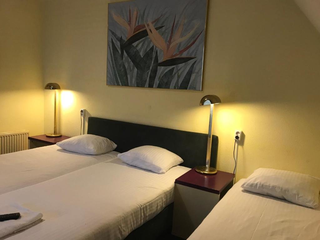 Standard quadruple chambre Hotel De Weyman