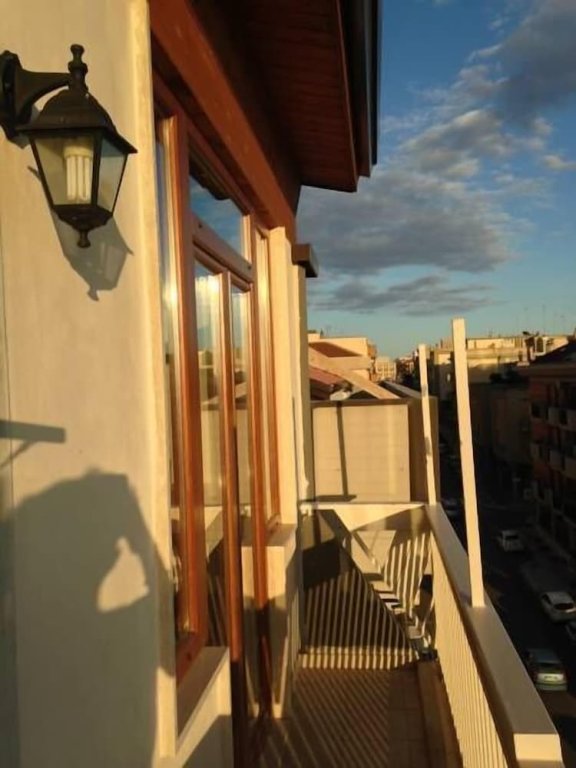Четырёхместный номер Economy с балконом Panorama Lucano