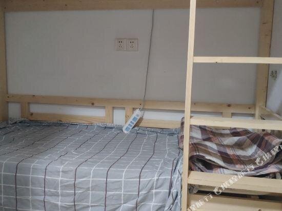 Кровать в общем номере Ganzhou Qixi International Youth Hostel
