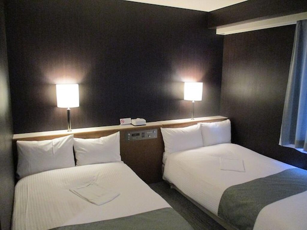 Bett im Wohnheim (Frauenwohnheim) Niigata Keihin Hotel
