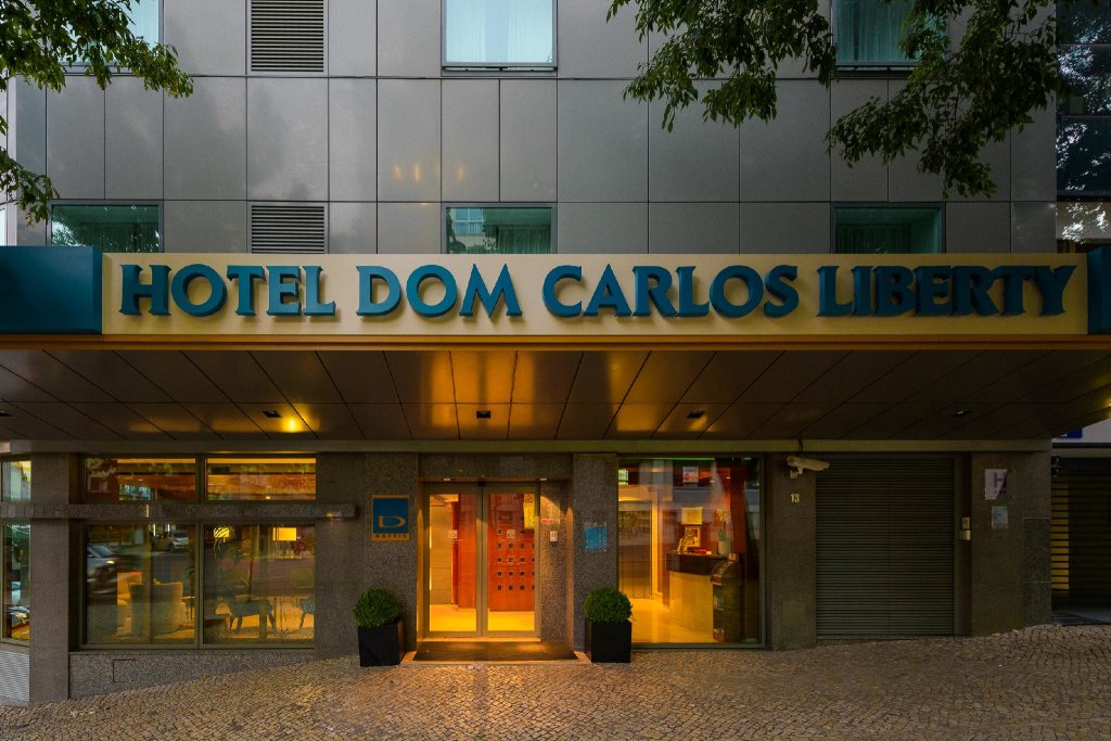 Кровать в общем номере Dom Carlos Liberty Hotel