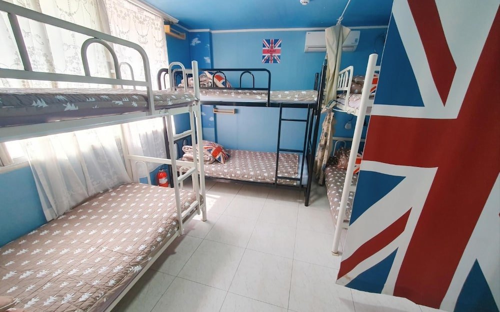 Кровать в общем номере Daegu Glenn's Guest House