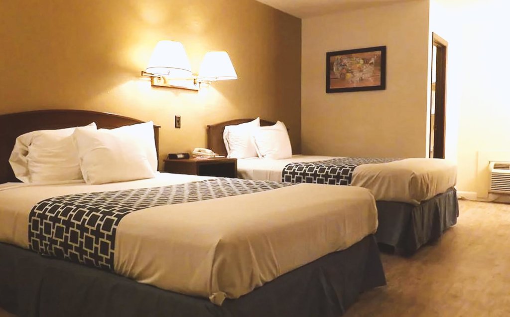 Deluxe Quadruple room Coratel Inn & Suites