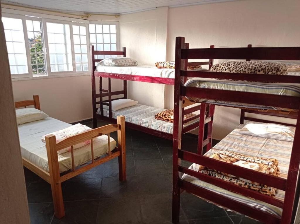 Кровать в общем номере Pousada Videiras Santa Rita de Cássia