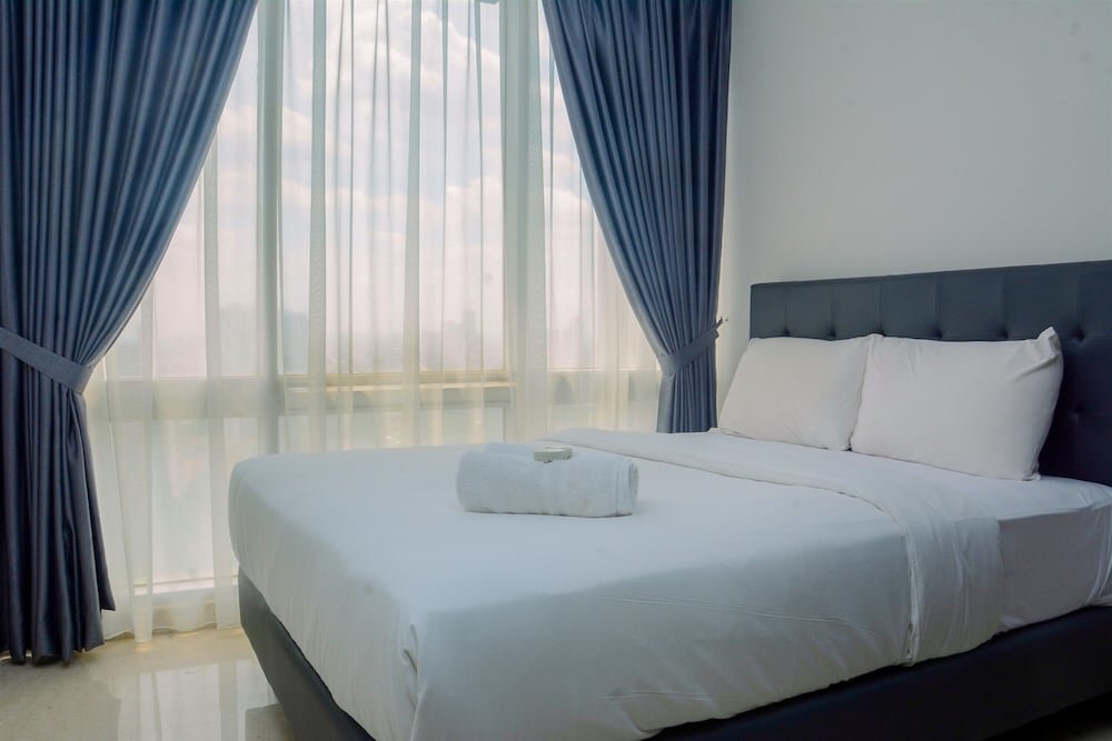 Standard room Comfy and Spacious 2BR The Masterpiece Epicentrum Apartment By Travelio