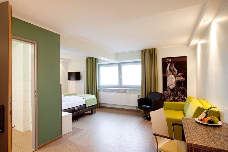 Кровать в общем номере Hotel Sportforum