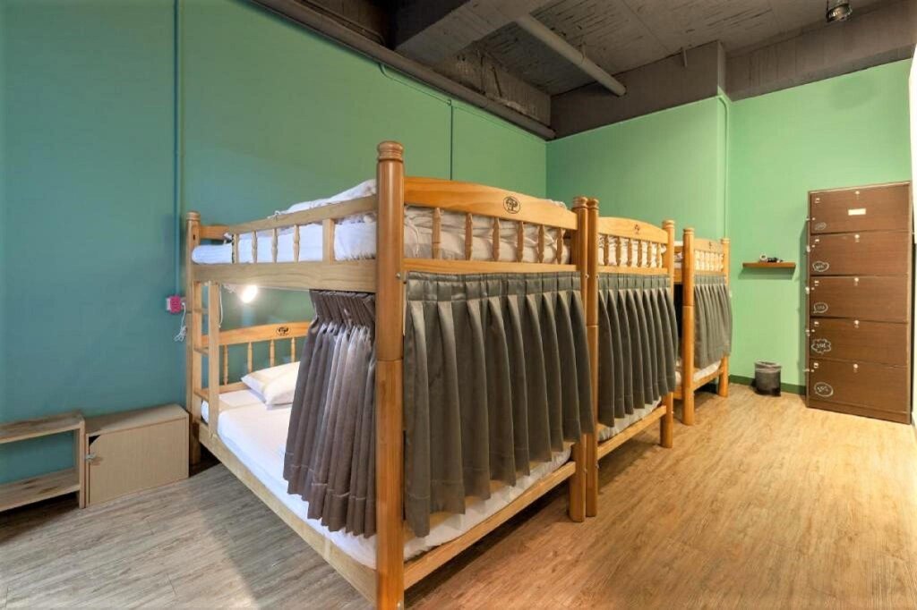 Cama en dormitorio compartido DongNing Atlas Hotel