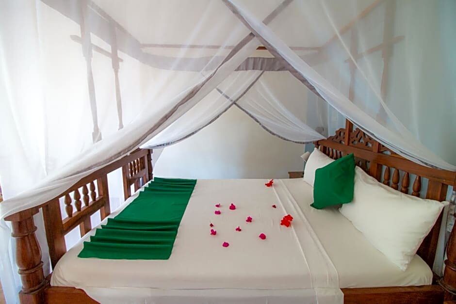Deluxe quadruple chambre Vue mer Tanzanite Beach Resort