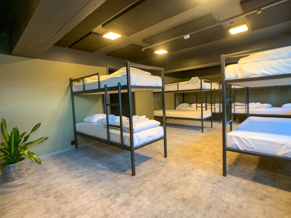 Кровать в общем номере Spåtind Fjellstue