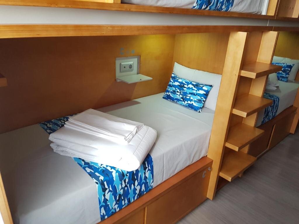 Кровать в общем номере Hostel da Praça