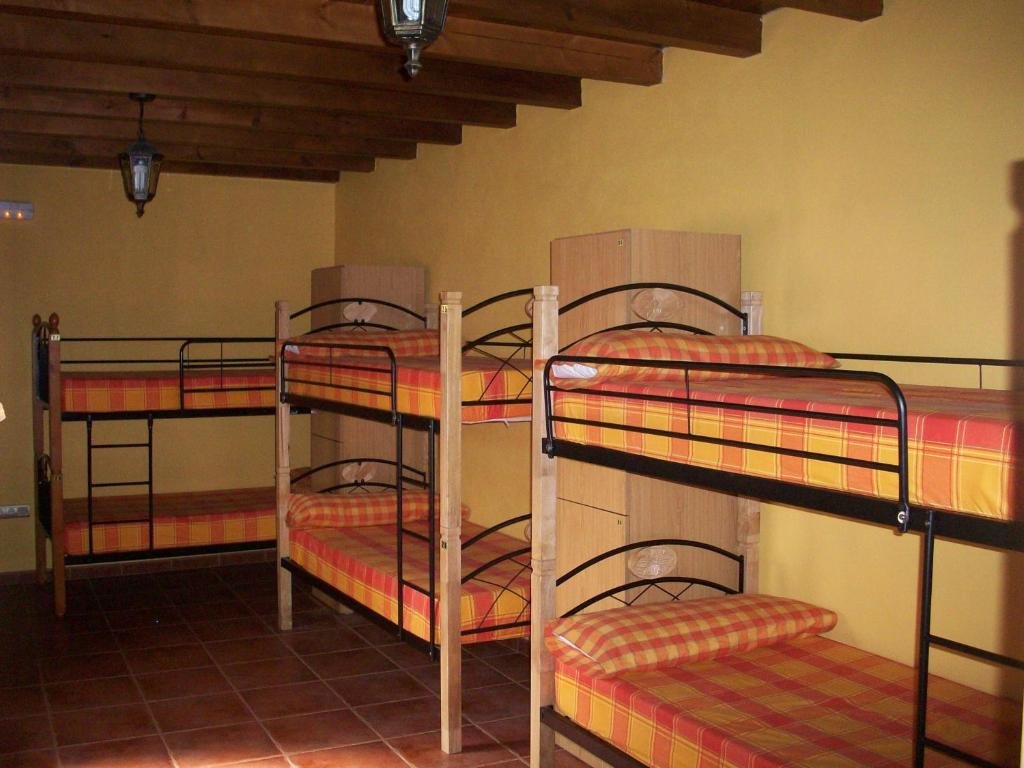 Кровать в общем номере Albergue Estrella Del Camino