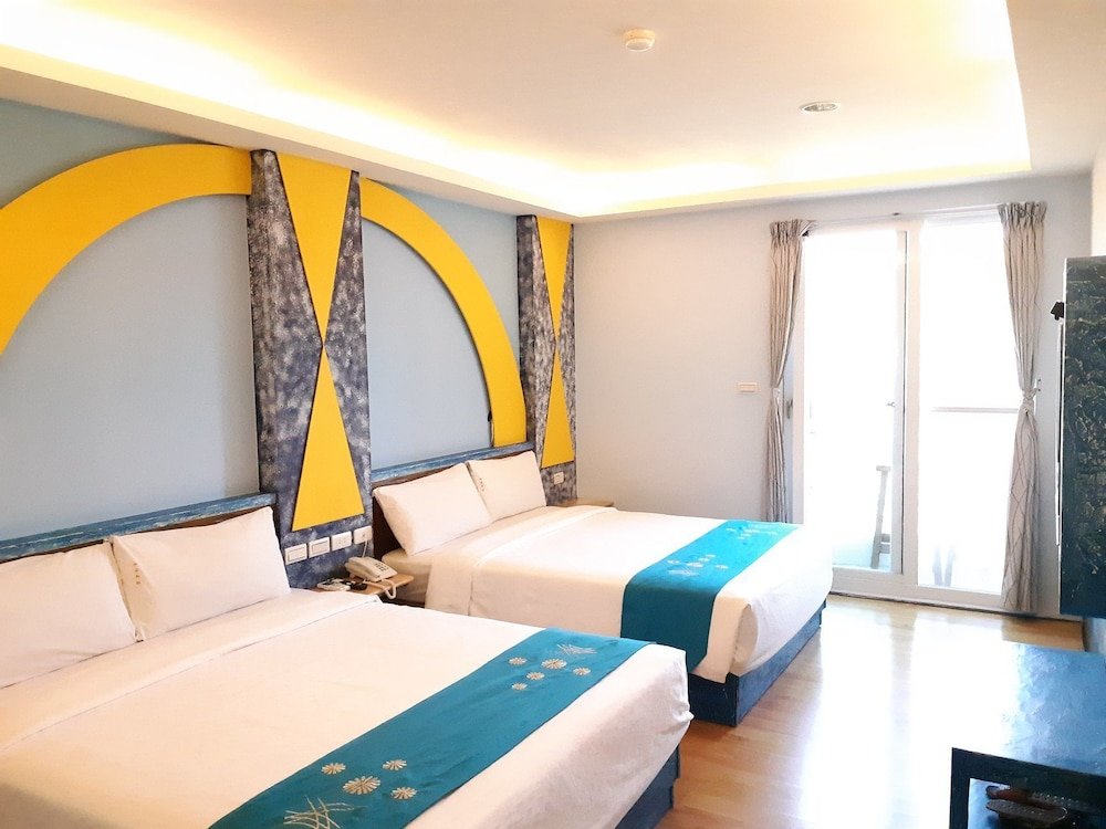 Standard Quadruple room with balcony and with mountain view HuanGjia Hotel