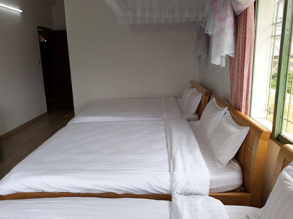 Кровать в общем номере Ngọc Bích Hotel