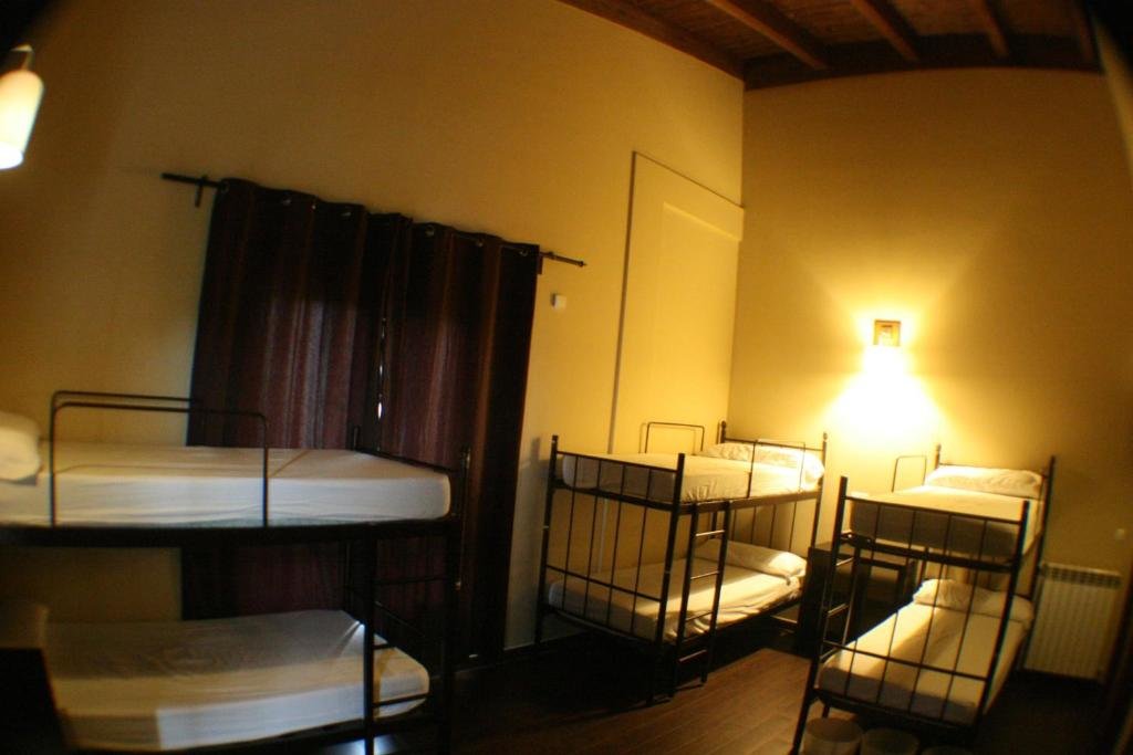 Cama en dormitorio compartido Casa Barbadelo