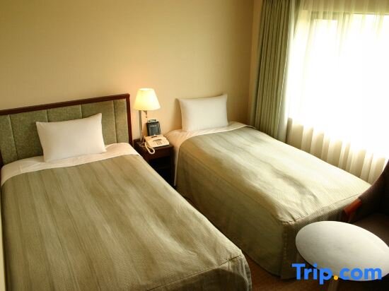 Кровать в общем номере HOTEL JAL City Tsukuba