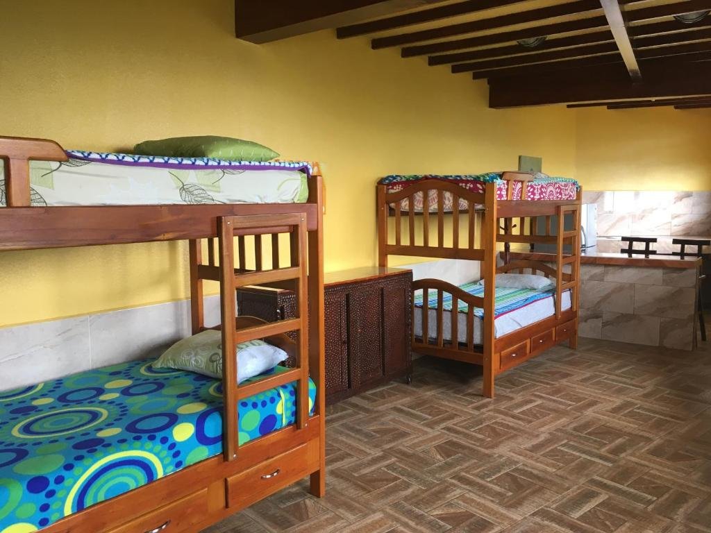 Кровать в общем номере Mirador Finca Morrogacho