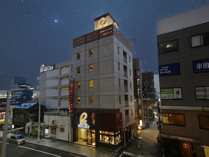 Кровать в общем номере HOTEL RELIEF Kokura Station