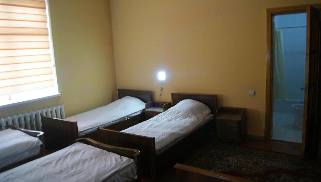 Cama en dormitorio compartido Hotel Sartepo