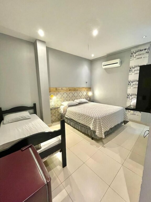 Трёхместный номер Standard c 1 комнатой HMG Suites Inn Budget Rio