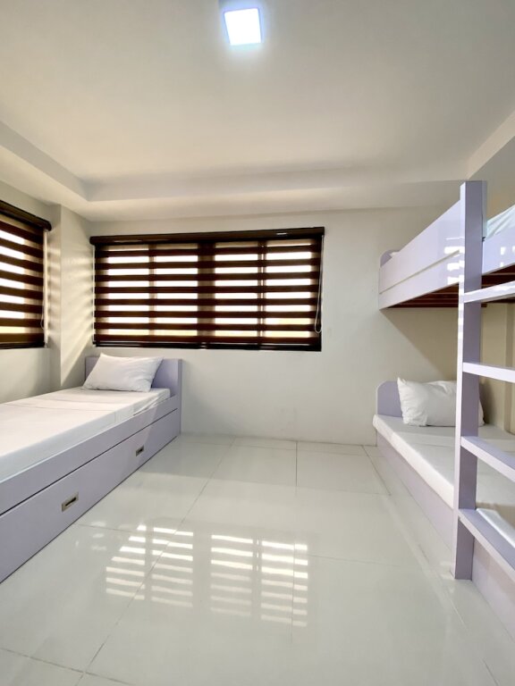 Cama en dormitorio compartido Staycation Hotel
